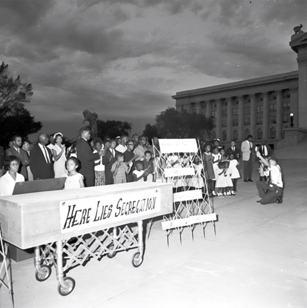 In 1963, on the same day that Dr. Martin Luther King, Jr. delivered his famous "I Have A Dream" speech at the March on Washington, protestors gathered at the Oklahoma State Capitol to hold a "Jim Crow funeral."