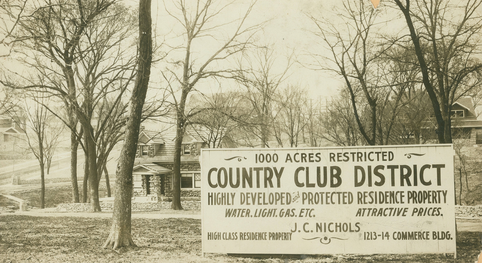 A J.C. Nichols Company real estate sign in Kansas City, Missouri reads: “1000 Acres Restricted;" “Country Club District;” “Highly Developed and Protected Residence Property;” “Water, Light, Gas, Etc. Attractive Prices."