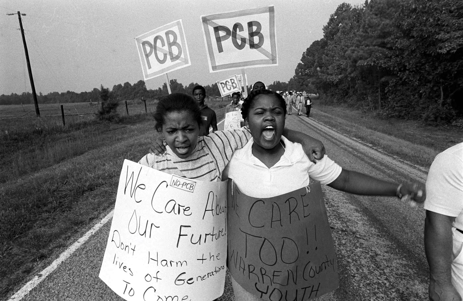 Photo of children protesting PCB chemicals.