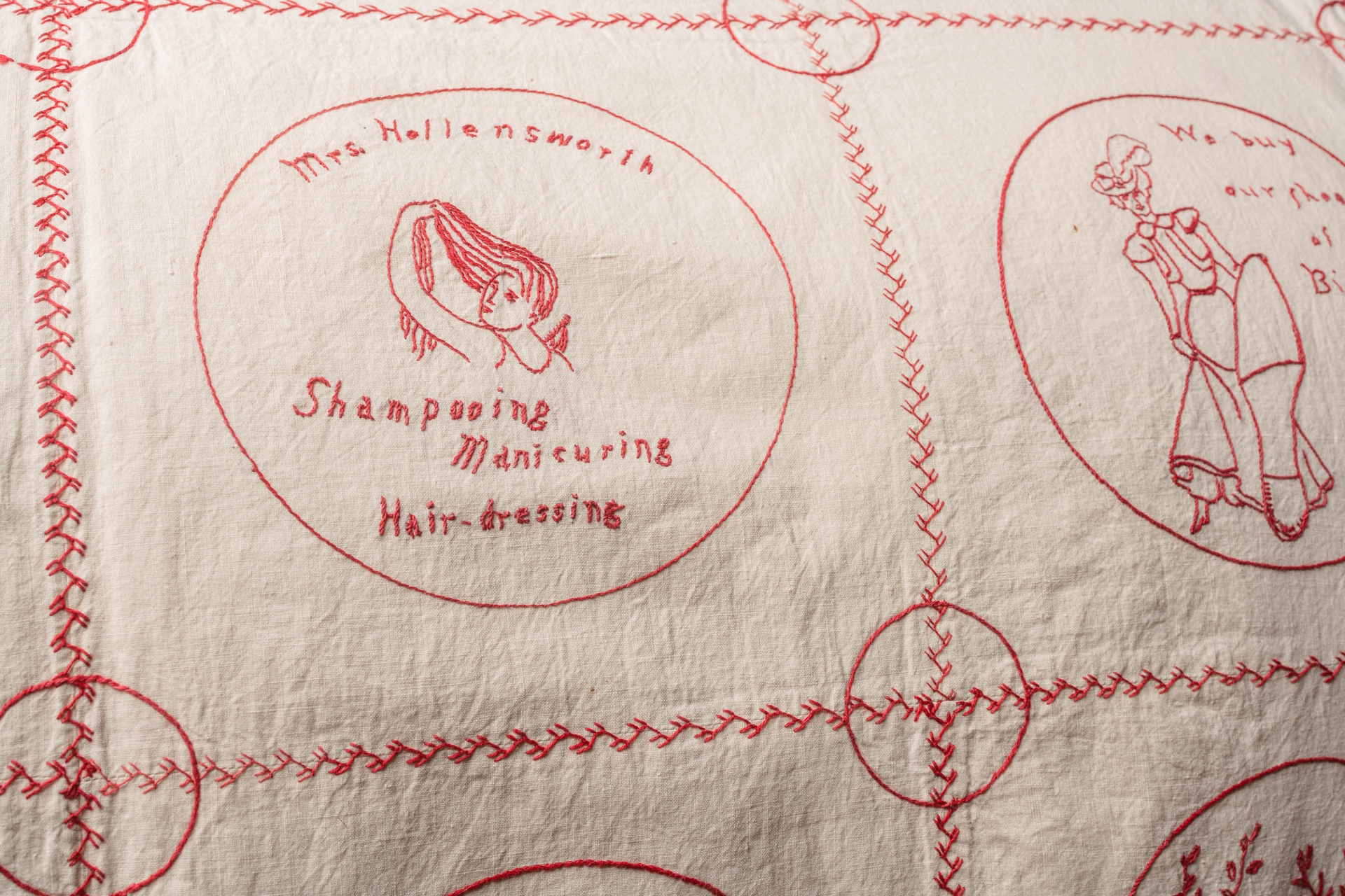 Embroidered on this redwork quilt made by Teresa Wagg in 1900 is "Mrs. Hollensworth Shampooing Manicuring Hair-Dressing" promoting a Black-owned business. Business owner Emma Hollensworth also worked at the Appleton Children's Home as a matron. Her daughter, Gertrude Louise Hollensworth, was a school teacher. They were part of the "Black Aristrocracy" of Appleton.