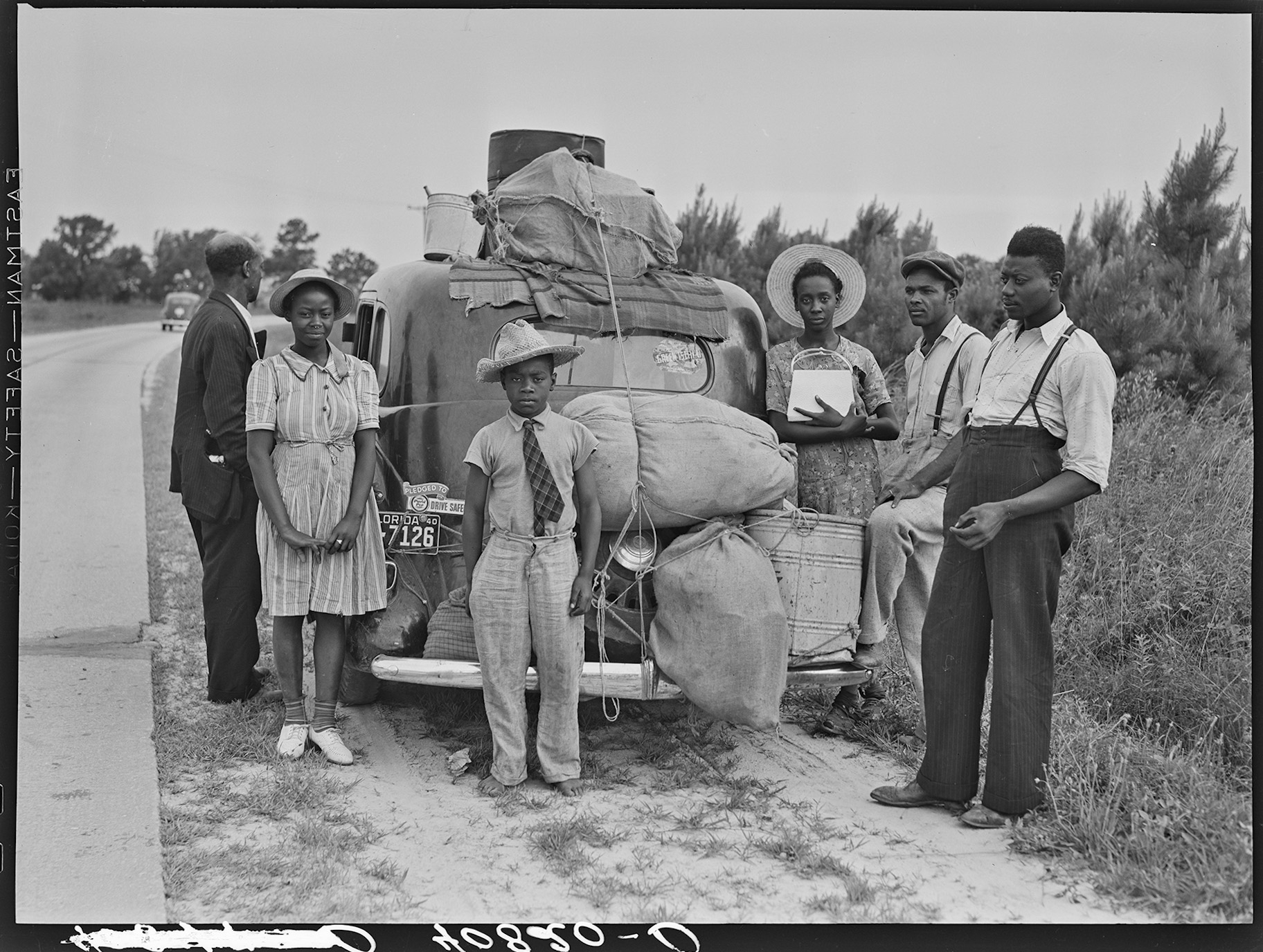 From 1915 to 1970, Black southerners ventured to the North and West in search of better jobs and freedom from racial terrorism. These travelers from Florida were headed to Cranberry, New Jersey to pick potatoes in 1940.