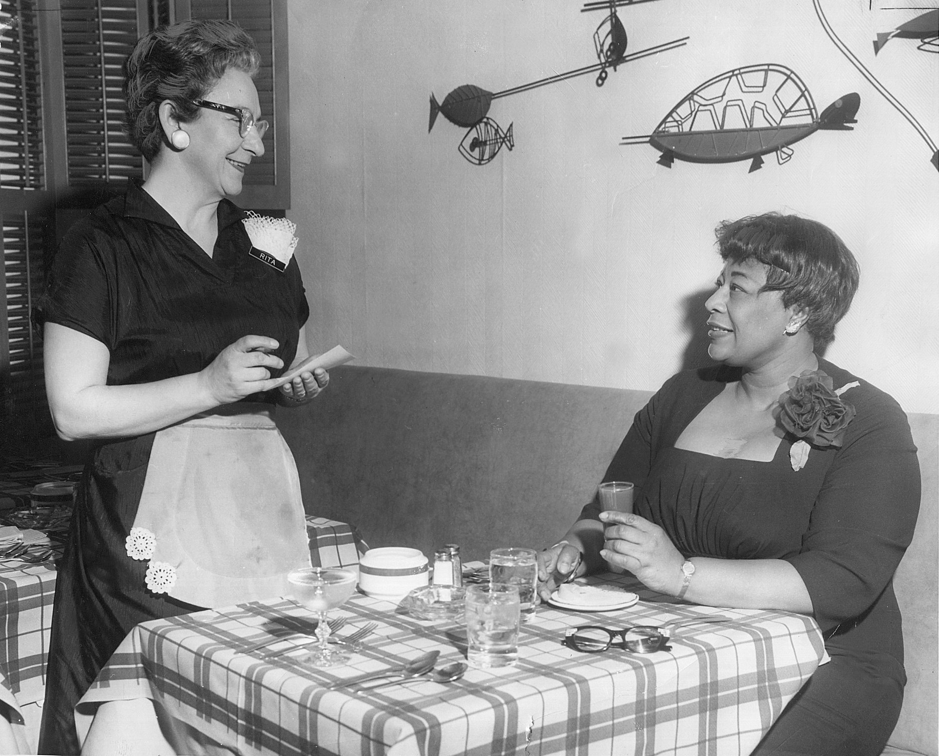 Ella Fitzgerald is intentionally photographed for the Appleton Post-Crescent in 1961 having breakfast at the Conway Hotel to illustrate more open access to Black people.